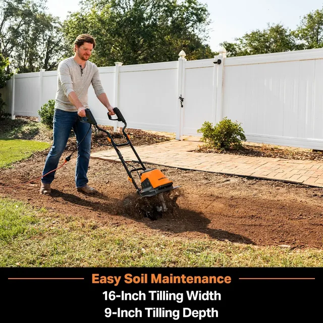 Man operating a front-tine tiller with 16-inch width and 9-inch depth to maintain garden soil near a white vinyl fence.