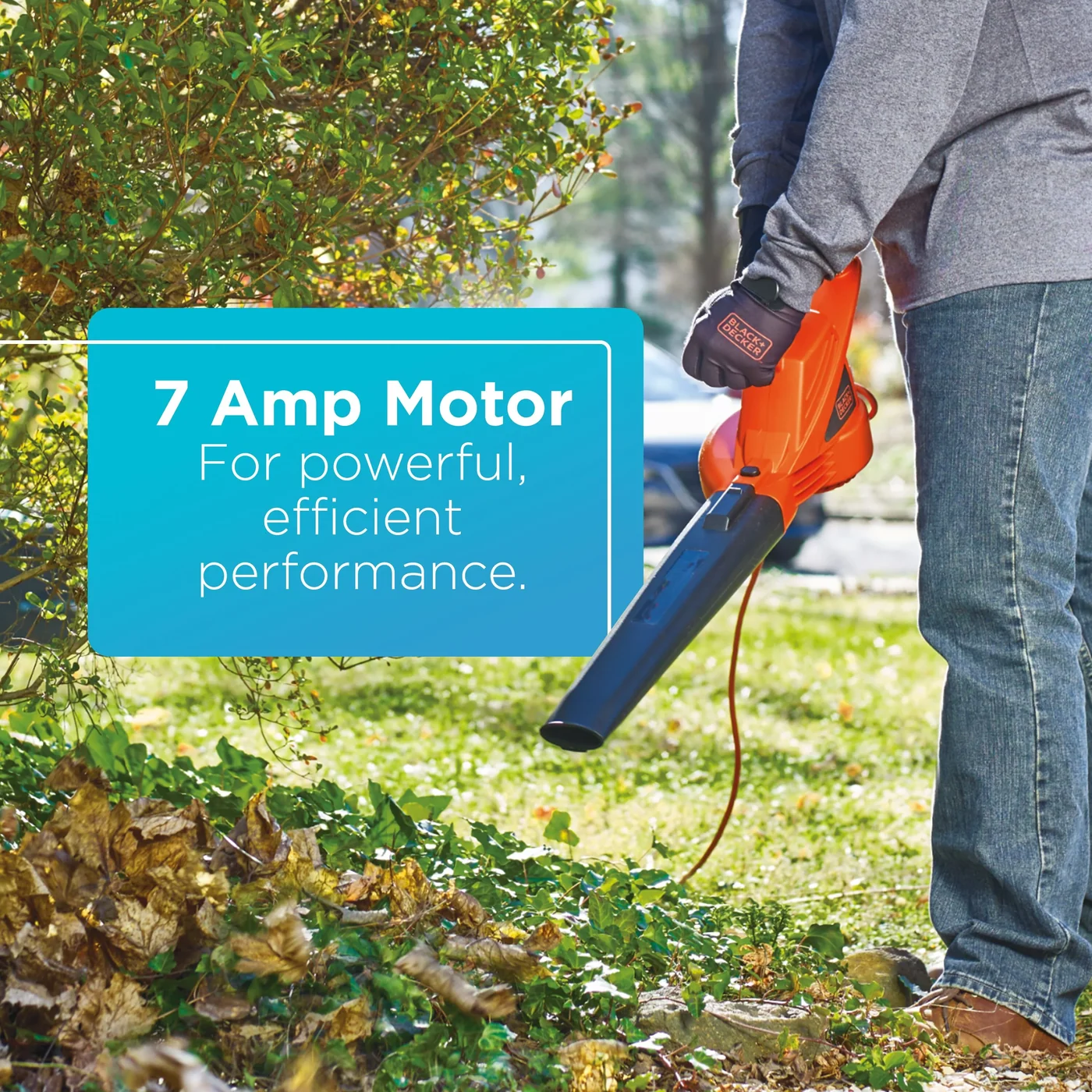A person clears leaves with the BLACK+DECKER 7-Amp Electric Leaf Blower. 7-Amp motor for powerful, efficient performance.