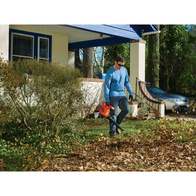7 Amp Blower being used by a person outdoors.
