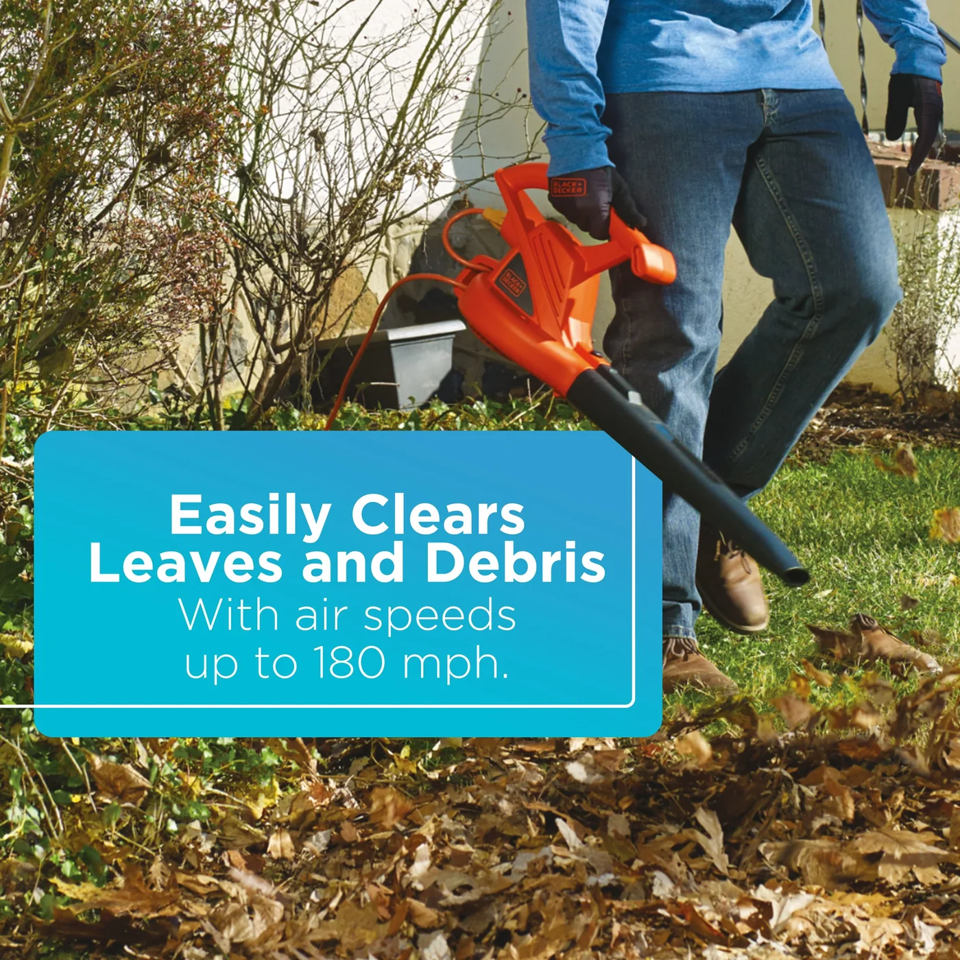 A person clears leaves with the BLACK+DECKER 7-Amp Electric Leaf Blower. Easily clears leaves and debris with air speeds up to 180 mph.