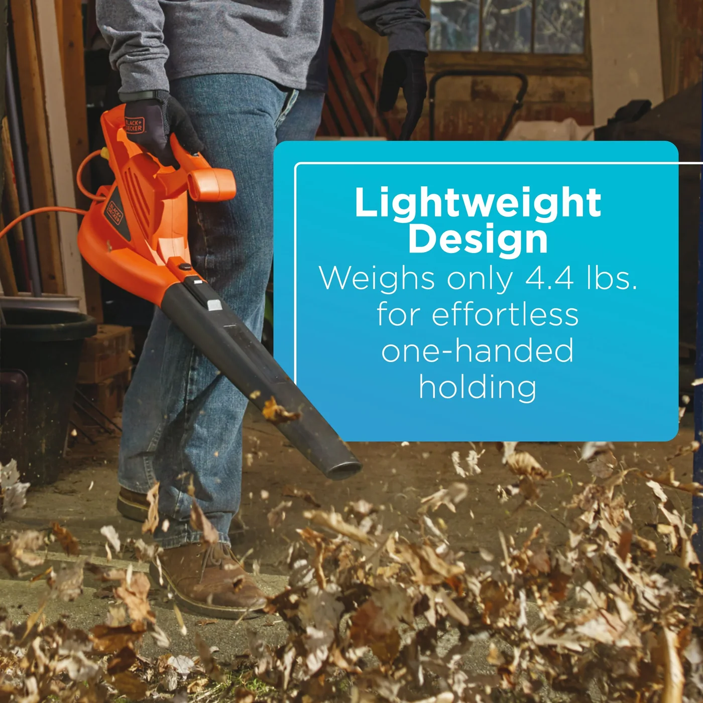 A person clears leaves with the BLACK+DECKER 7-Amp Electric Leaf Blower. Lightweight design. Weighs only 4.4 lbs. for effortless, one-handed holding.