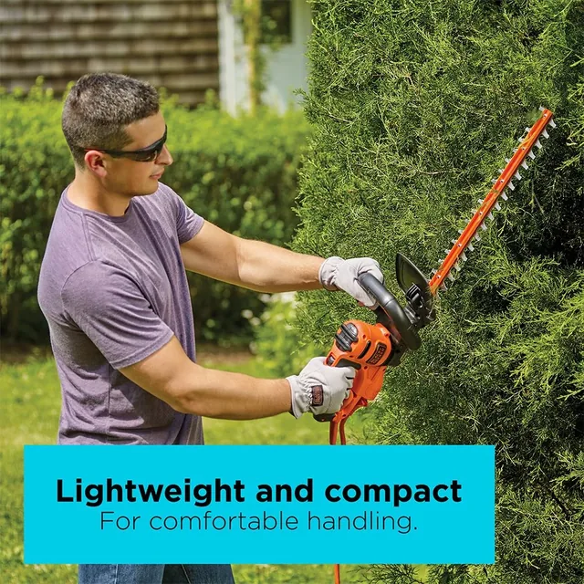 A man trims hedges with the BLACK+DECKER 22-in. Hedge Trimmer. Lightweight and compact for comfortable handling.
