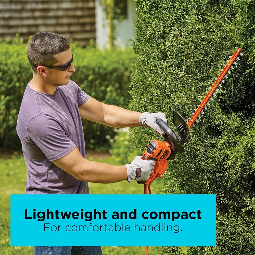 A man trims hedges with the BLACK+DECKER 22-in. Hedge Trimmer. Lightweight and compact for comfortable handling.