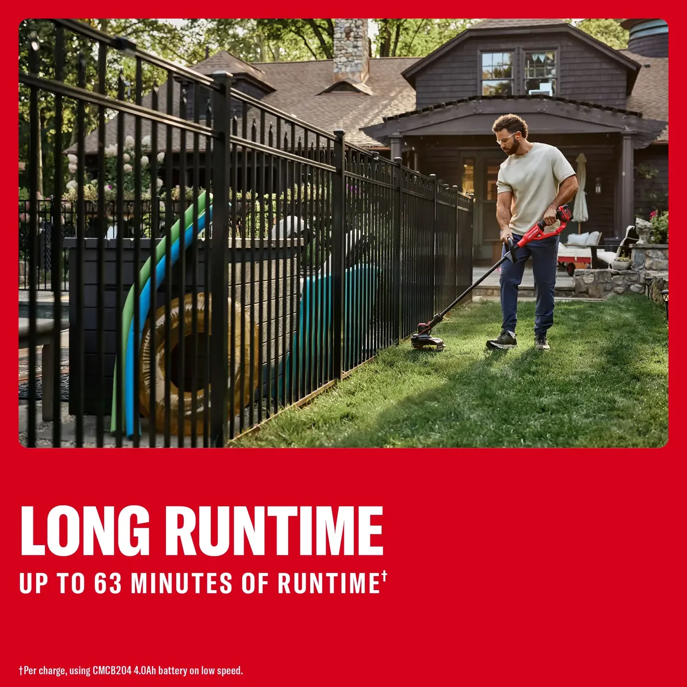 Photo of a person using a Craftsman cordless string trimmer CMCST901M1 to edge grass along a black metal fence in a yard.
