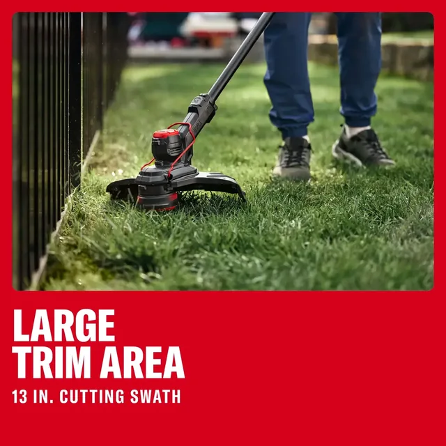 CRAFTSMAN string trimmer CMCST901M1 close-up on grass, user trimming lawn edge near fence, outdoor use.