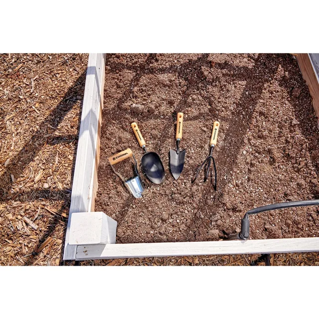 SP10002 three short wood-handle tools beside a raised bed; the large shovel is separate