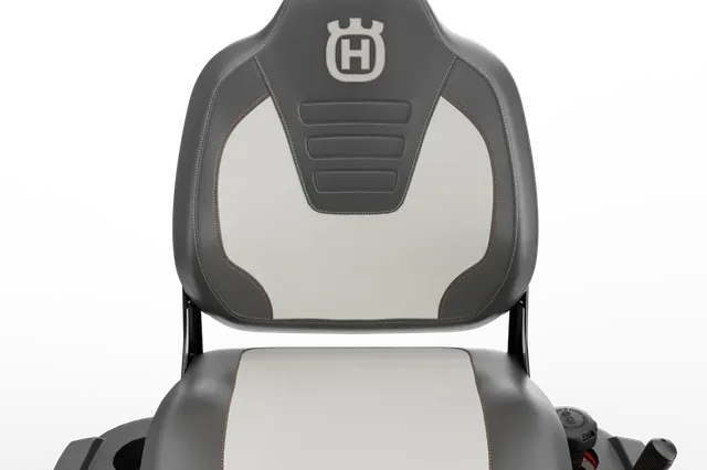 Rear view of a Husqvarna ride-on mower seat with branding visible.