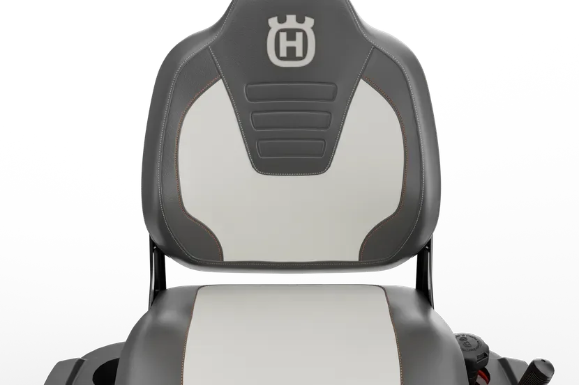 Rear view of a Husqvarna ride-on mower seat with branding visible.
